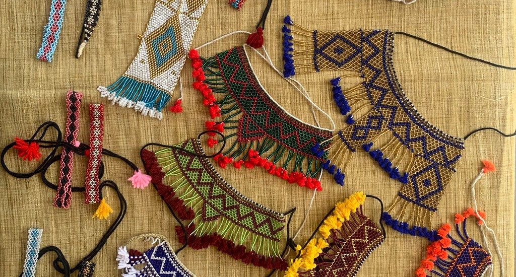 Kalbeliya beadwork hanging by a thread