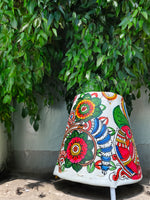Peacock's Brilliance: A Tholu Bommalatta Lamp of Colourful Splendour For sale