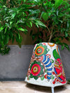 Buy exclusive Peacock's Brilliance: A Tholu Bommalatta Lamp of Colourful Splendour
