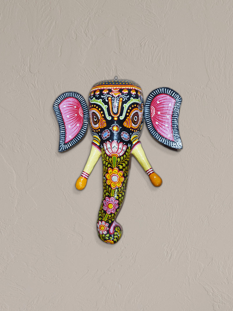 You can buy the book "TVibrant Splendor: The Captivating Artistry of Paper Mache Colorful Designer Elephant Face" at a local bookstore.