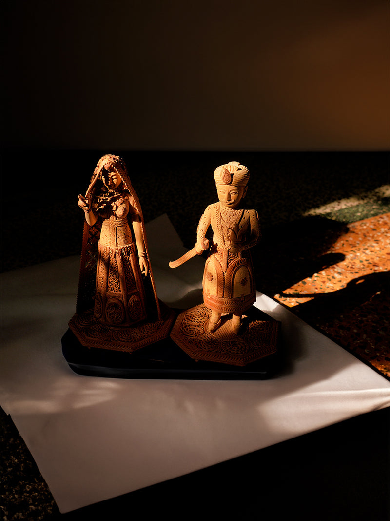 Purchase the graceful Sandalwood Carving "Ancient Tales on Wood: The Graceful of Raja Rani Ray" now.