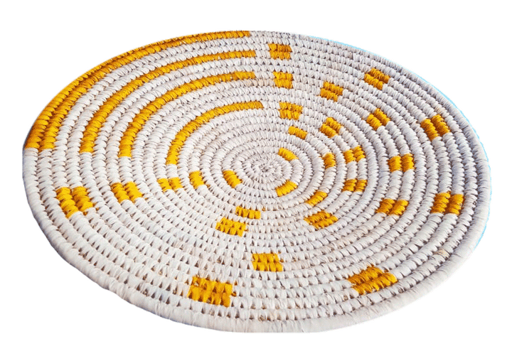 Arrangement of yellow on white plate Sabai Grass work by Dipali Mura Thumbnail