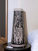 Celestial Love: Tholu Lamps of Radha and Krishna Amidst the Darkness for Sale