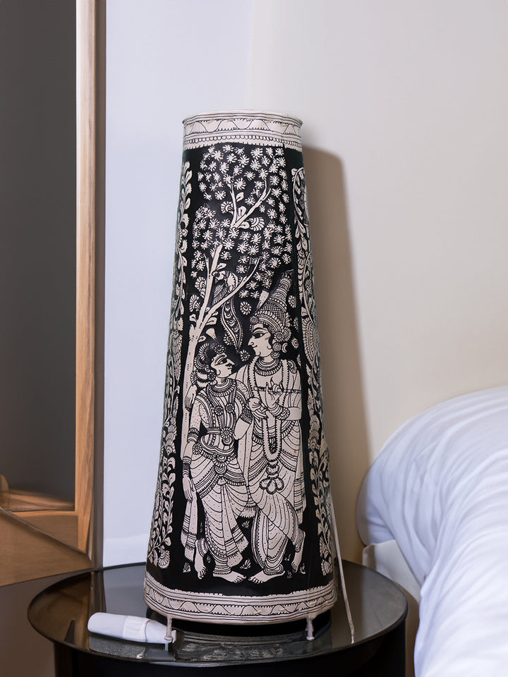 Celestial Love: Tholu Lamps of Radha and Krishna Amidst the Darkness by Kanday Anjanappa Thumbnail