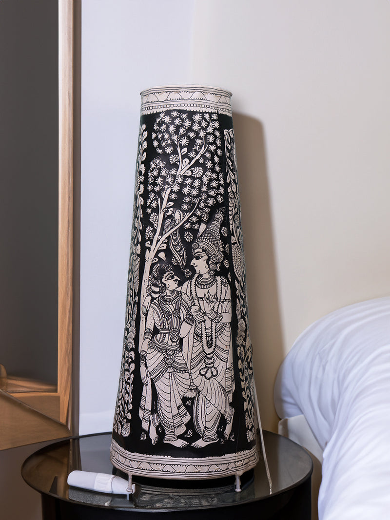 Celestial Love: Tholu Lamps of Radha and Krishna Amidst the Darkness for Sale