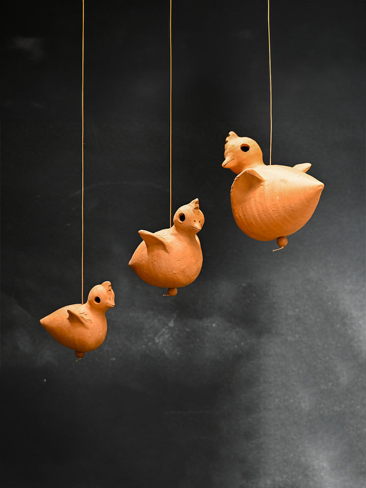 Charming Chirps: Terracotta Chick Wind Chime Ensemble by Dolon Kundu Thumbnail