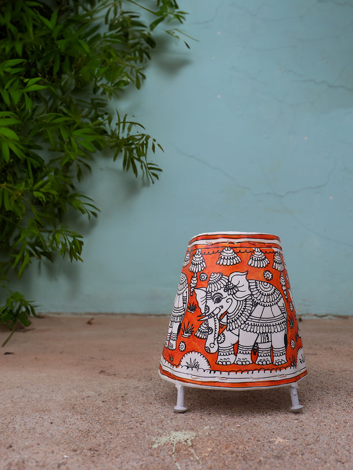 Crimson Majesty: Tholu Bommalatta Lamp of Splendour by Kanday Anjanappa Thumbnail