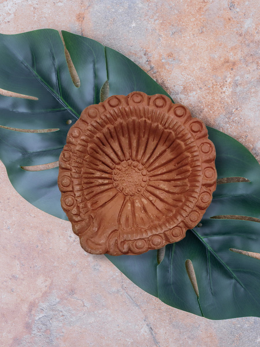 Diya with intricate petals: Terracotta Diya by Dolon Kundu