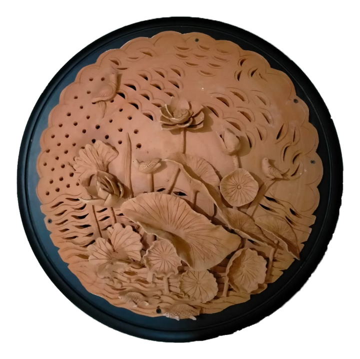 Depiction of lotus flower with leaves in Terracotta by Dolon Kundu Thumbnail