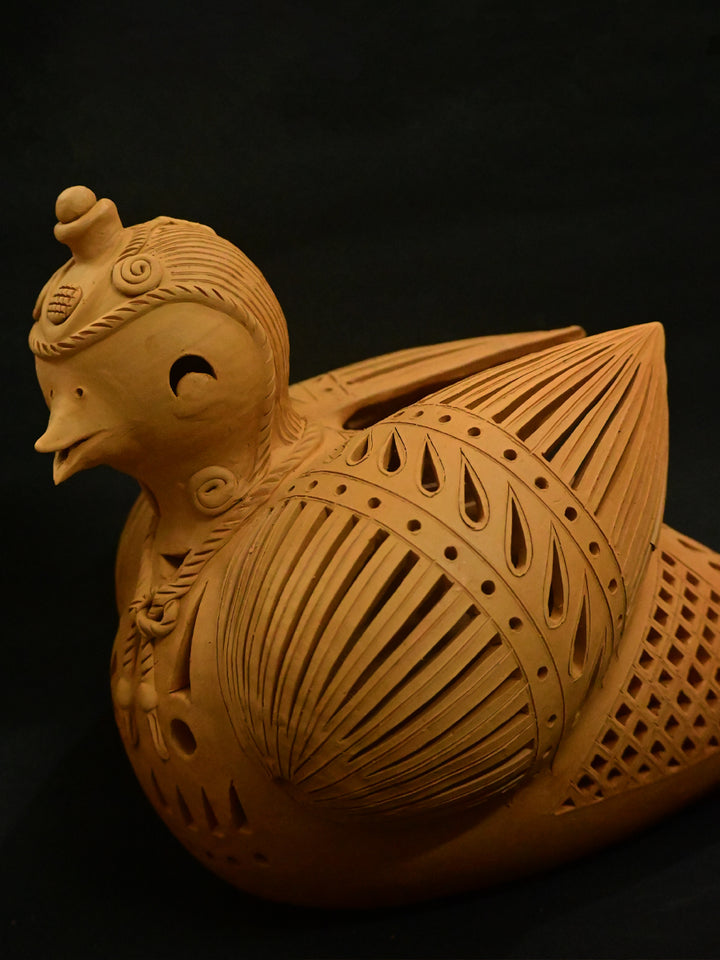 Feathered Radiance: A Terracotta Tea Light, Terracotta art by Dolon Kundu Thumbnail