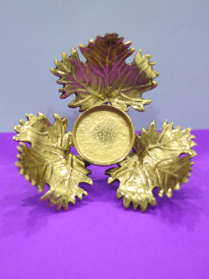 Grape leaf Tea-light holder in Brass work by Chanchal Chakraborty Thumbnail