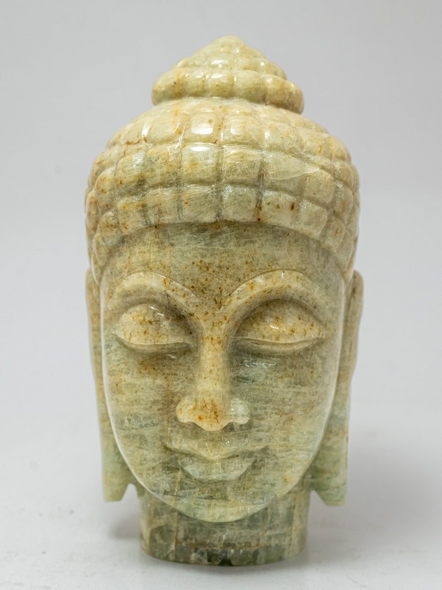 Harmony in Stone: The Golden Aquamarine Buddha's Eternal Tranquility