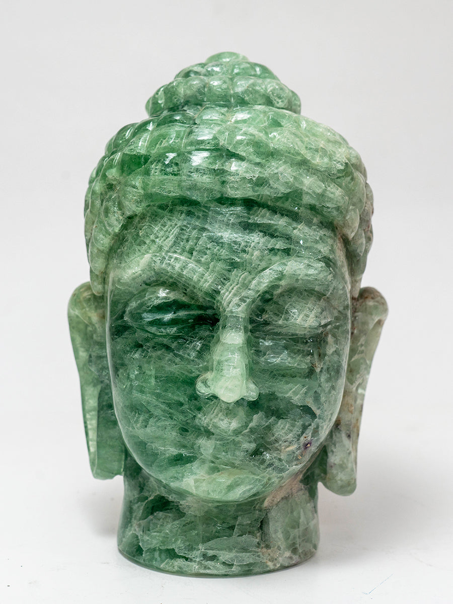 Jade Serenity: The Green Fluorite Buddha's Peaceful Countenance 