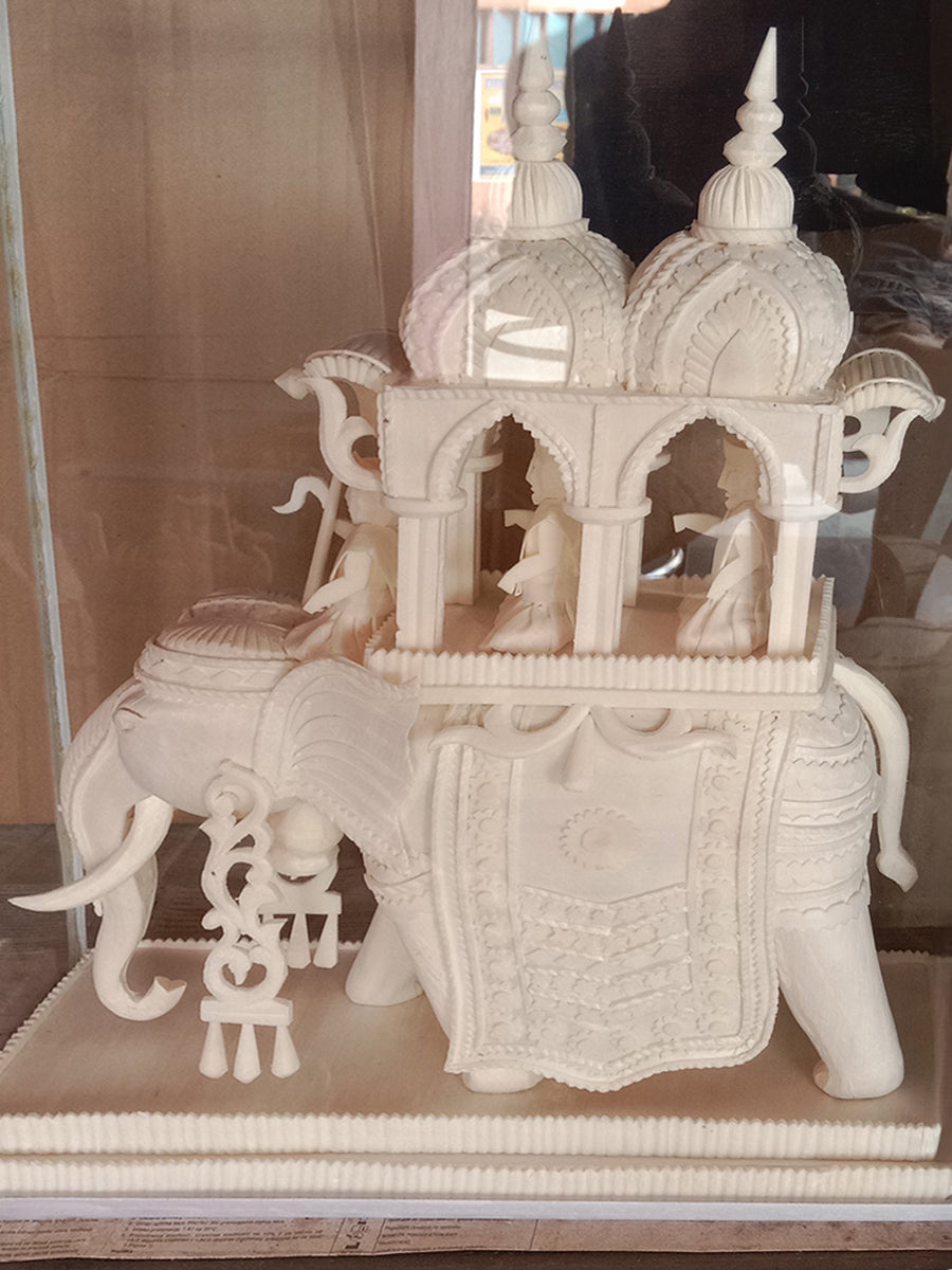 Journey of Majesty: A Shola Pith Carving of Howdah by Arup Malakar