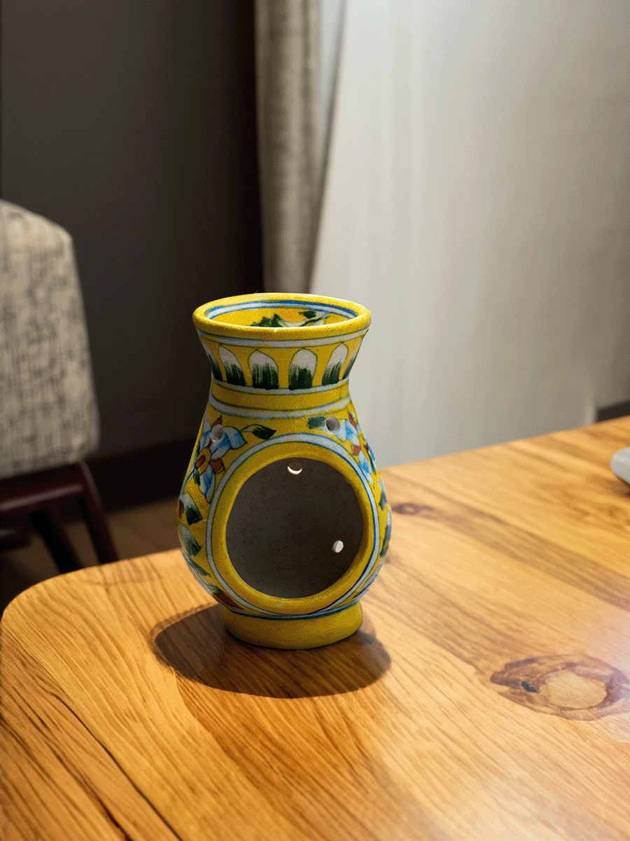 Buy online Radiant Blooms: Tealight Harmony in the Yellow Pot Blue Pottery 
