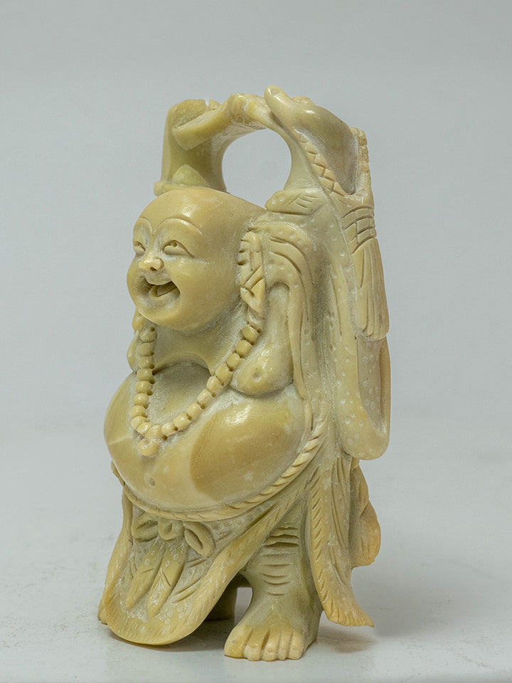 The Uplifted Spirit: Yellow Serpentine Sculpture of the Smiling Buddha by Prithvi Kumawat Thumbnail
