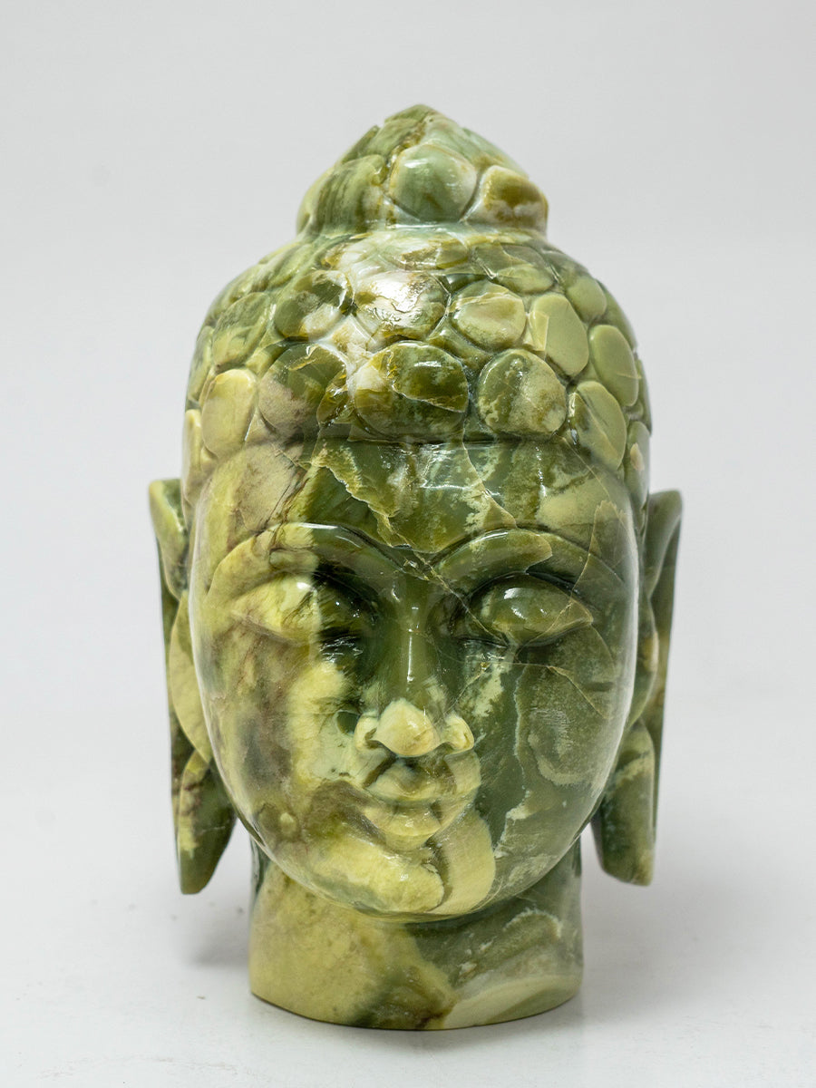 Whispers of Wisdom: The Green Serpentine Buddha's Enlightened Presence 